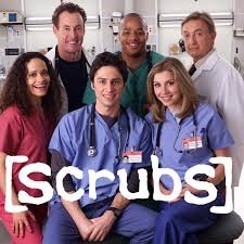 A promotional cast photo for the TV show "Scrubs," featuring six main cast members posing in a hospital setting. Three characters are seated in the front wearing scrubs, while three stand behind them in scrubs and white doctor's coats. The show's title, "[Scrubs]", is overlaid in white text at the bottom. Which inspired dead honor manga author.