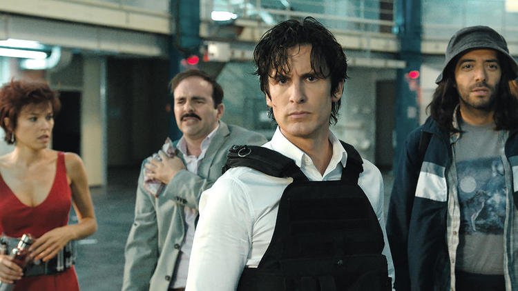 City Hunter and it's many amazing adaptions 40 A movie still featuring four cast members from the French film "Nicky Larson" looking serious, representing the ensemble casts of live-action City Hunter adaptions.