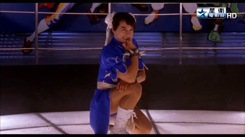 City Hunter and it's many amazing adaptions 35 Jackie Chan cosplaying as Chun-Li in a comedic fight scene, highlighting the slapstick humor found in live-action City Hunter adaptions.