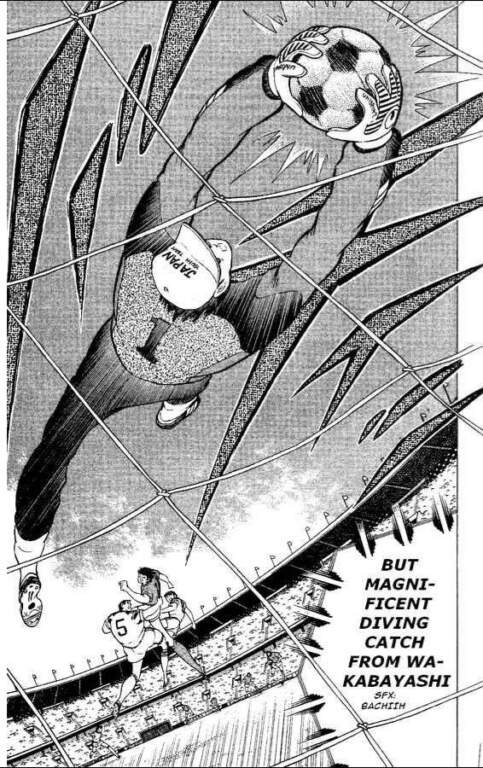 Read World Cup Football Manga To Keep The Excitement Going 10 "Captain Tsubasa manga panel: goalkeeper Wakabayashi makes a diving save, gloves gripping the ball against the net, viewed from behind the goal with players and the stadium crowd below. Caption text credits the magnificent diving catch."